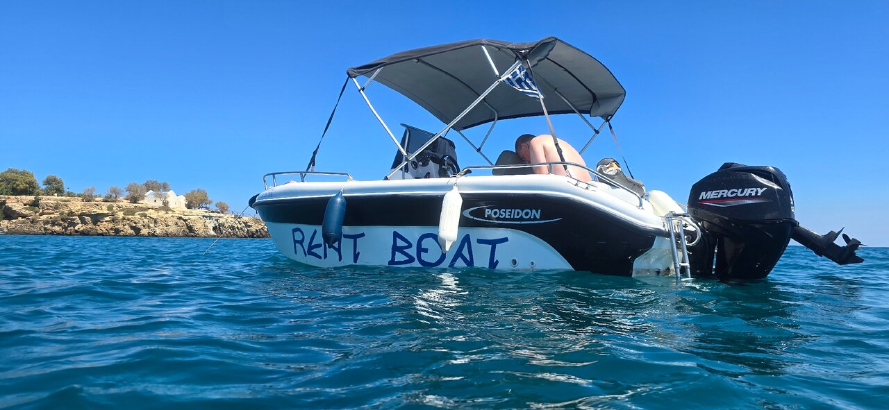 Sunlit boat deck with sea views from a private rental boat